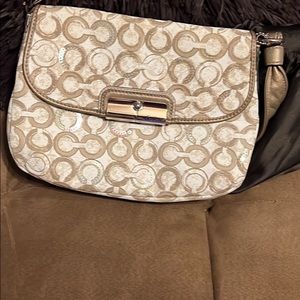 Coach handbag. Beautiful golds silver and cream colored. Only used once